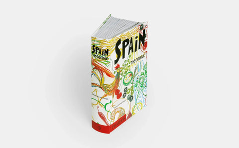 Colorful book titled 'Spain' on a white background