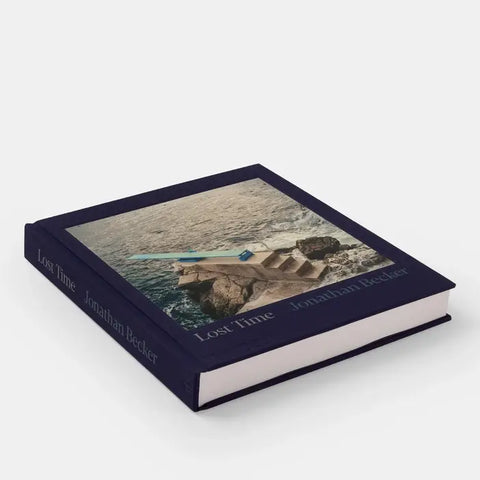 Book titled 'Lost Time' by Jonathan Becker with a cover image of a person on a rock by water.