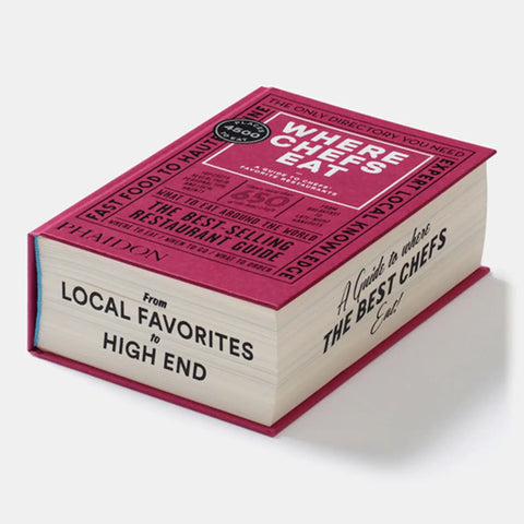 Book titled 'Where Chefs Eat' with a pink cover on a white background