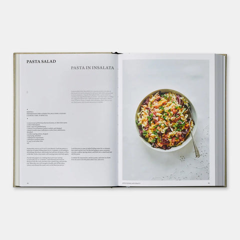 Open cookbook showing a recipe for Pasta Salad with an image of a bowl of pasta salad on a white background.