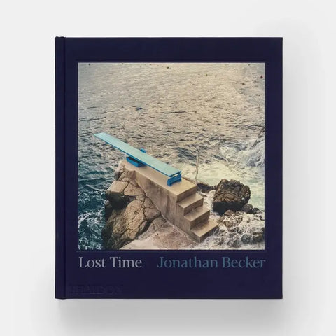 Book titled 'Lost Time' by Jonathan Becker with a cover image of a blue structure on rocks over water.