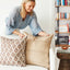 Tashkent Sumac pillow layered with coordinating pillows