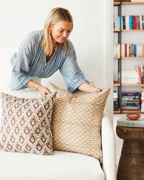 Tashkent Sumac pillow layered with coordinating pillows