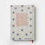 Book cover with decorative pattern and text on a white background