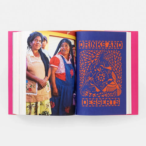 Open book showing a photo of people and a colorful design on a white background