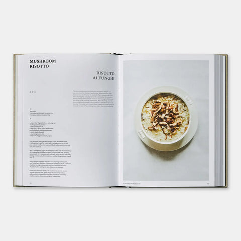 Open cookbook showing a recipe for mushroom risotto with an image of the dish on a white background.
