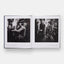 Open book showing black and white photographs of people in a room.
