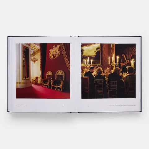 Open book showing two images: one of a formal room with red carpet and chairs, the other of a group dining in a candlelit setting.