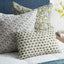 Marbella Moss Azure pillow layered with coordinating pillows