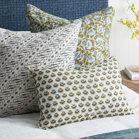 Marbella Moss Azure pillow layered with coordinating pillows