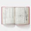 Open book with a map and text on a white background