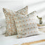Avignon Sahara pillow layered with coordinating pillows