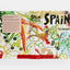 Colorful book titled 'Spain: The Cookbook' on a white background
