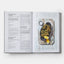 Open cookbook showing a recipe for Nori Seaweed and Egg Fritters with a photo of the dish on a marble surface.