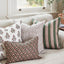 Fossano Cocoa pillow layered with coordinating pillows